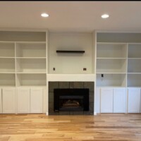hardwood floor with wall entertainment system