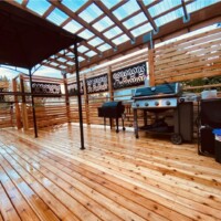 Outdoor patio with gazebo and grill that was remodeled